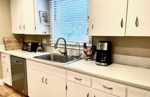 Suttons Bay House | 2/2 CUTE, ANTIQUE FILLED HOME DOWNTOWN SUTTONS BAY!