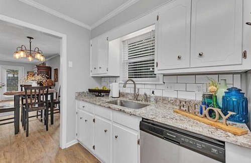 National Hills House | 2-bedroom home with 1.5 bathrooms and fully fenced backyard. The sleeping arrangements are 1 king bed and 1 queen bed.