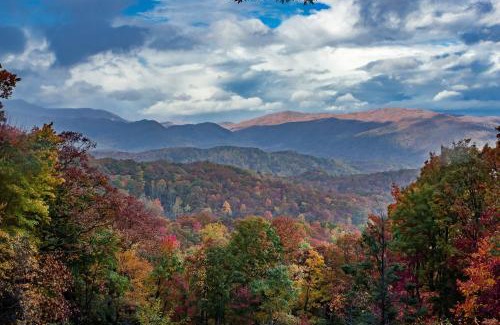 Pigeon Forge House | 2 Miles from Dollywood Family Resort with Seasonal Outdoor Swimming Pool, Year around Heated Indoor Swimming Pool, Townhome Style Cabin, Private Hot Tub, Arcade, TV, Wifi, Kitchen with Refrigerator, Washer and Dryer