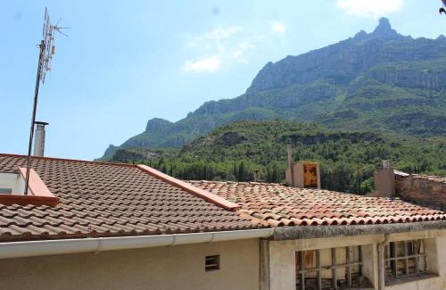 Monistrol de Montserrat Apartment | 3-Story Gaudi Building with Montserrat Stone