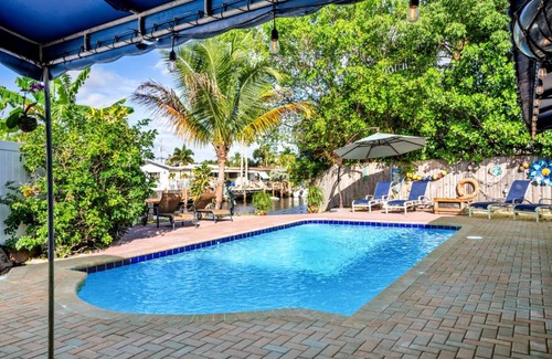 Garden Isles House | 4 bd Near beach spacious solar heated pool waterfront home