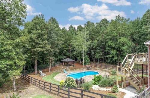Flowery Branch House | 6-bedroom pool house near lake in Flowery Branch with fitness & game room
