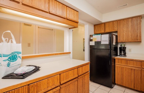 Caswell Beach House | 9th Tee: Patio Home Overlooking the 9th Tee with Screened Porch Close to Beach