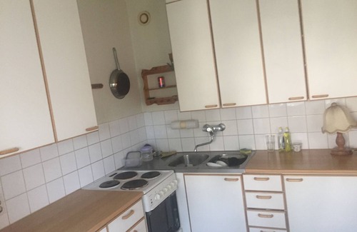 Lantinen District Apartment | A cozy room in kannelmaki