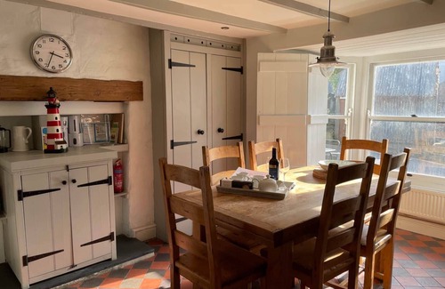 Tan-y-groes House | A delightful seaside stone cottage, just a minute's walk from the beach.