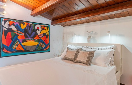 Portopalo di Capo Passero House | Apartment '3 Twins Suite Portopalo' with Shared Garden and Air Conditioning