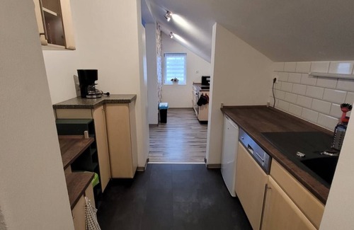 Burg Stargard Apartment | Apartment without fireplace in the attic - Onkmangani Appartmenthaus Oelschläger