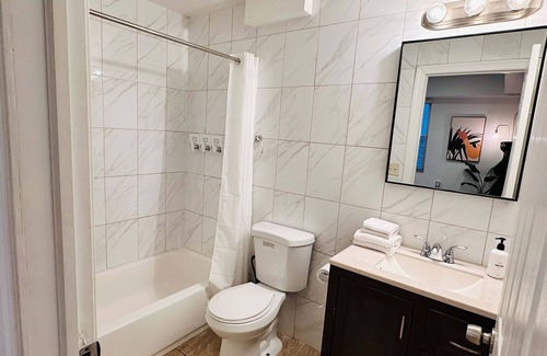 Chinatown Apartment | Arcade 2BR Apt in Walk-up w Laundry