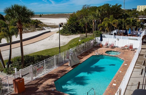 Treasure Island Condo | Beachfront Condo. Heated Pool. Activities, Fun, End Unit, Parking, & Great Location!