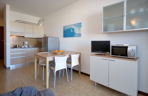 Lignano Sabbiadoro Apartment | Beautiful apartment for 4 guests with A/C, pool, TV, terrace and pets allowed