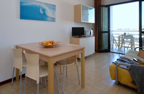 Lignano Sabbiadoro Apartment | Beautiful apartment for 4 guests with A/C, pool, TV, terrace and pets allowed
