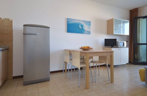 Lignano Sabbiadoro Apartment | Beautiful apartment for 4 guests with A/C, pool, TV, terrace and pets allowed