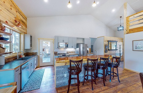 Three Rivers House | Beautiful riverfront home with private dock, fireplace, WiFi, and patio