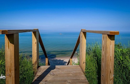 Muskegon House | Beautiful waterfront home with 190ft private sandy beach and stunning views