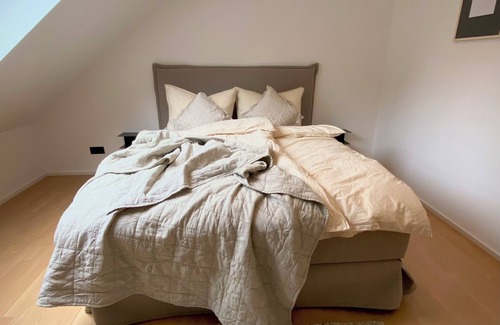 Losheim am See Apartment | BioLoft by the lake and distant views. Cozy vacation apartment on the top floor