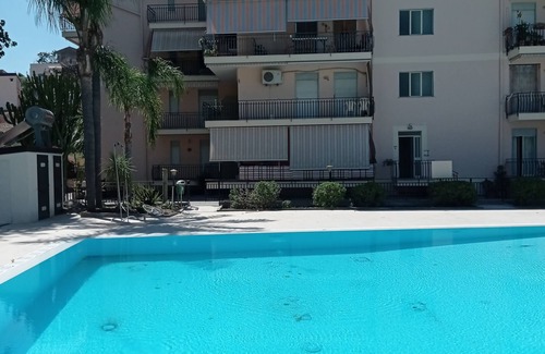 Calatabiano Apartment | Bouganville Residence - Family suite with swimming pool, tennis court, playground.