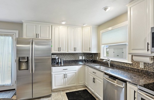 Parkville House | Boutique style home with original works of art on a gorgeous tree lined street.