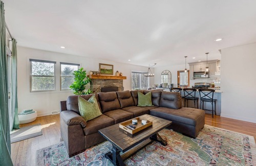 Cambridge House | Bright hilltop retreat with stunning mountain views, wrap-around windows, and cozy seating to take it all in. Nestled on a private, scenic property minutes from charming Cambridge village—perfect for a peaceful getaway year-round.