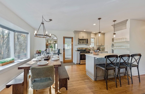 Cambridge House | Bright hilltop retreat with stunning mountain views, wrap-around windows, and cozy seating to take it all in. Nestled on a private, scenic property minutes from charming Cambridge village—perfect for a peaceful getaway year-round.