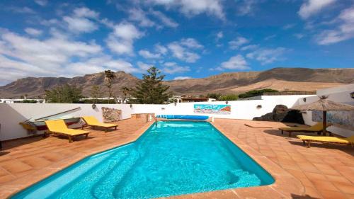 Urbanizacion Famara Villa | Bungalow Allende Famara con piscina privada y AC