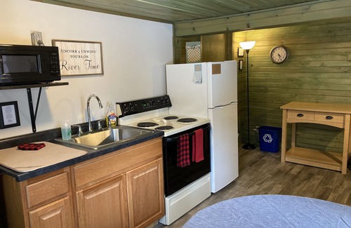 Eagle River Cottage | Cabin on the Eagle River Chain! Boat dock slip! Kayaks! Firewood for bonfires!