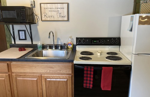 Eagle River Cottage | Cabin on the Eagle River Chain! Boat dock slip! Kayaks! Firewood for bonfires!