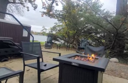 Alto Apartment | Campau Lake 3 Cottages Sunny Days and Sunshine Tiki game house