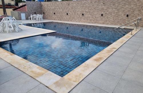 Pilar House | Casa 85 m2 no FORTE 2 quartos campinho piscinas 2 vagas no estacionamento portaria ar condicionado para 8 pessoas