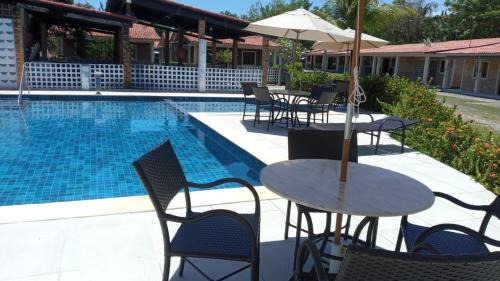 Pilar House | Casa 85 m2 no FORTE 2 quartos campinho piscinas 2 vagas no estacionamento portaria ar condicionado para 8 pessoas