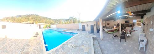 Caiubura House | Casa em Bertioga com piscina aquecida