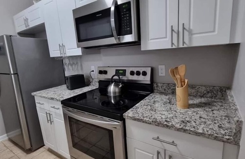 Windsor Palms Condo | CasaComfort near Disney-King Suite bedroom, FREE Amenities, and great location.