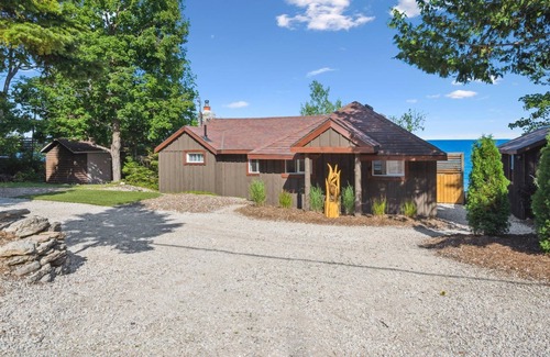Dyer's Bay House | Cedar & Stone is a TICO licenced serene waterfront escape in exclusive Dyers Bay. Nestled between Georgian Bay and the Niagara Escarpment, this stylishly renovated cottage offers peaceful mornings, cozy evenings, and nature right at your doorstep.