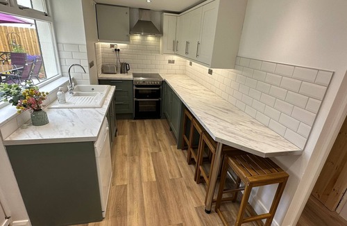 Cushendall House | Central Accommodation in a Converted Stables with a Hot Tub & Enclosed Yard