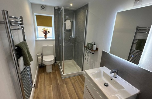 Cushendall House | Central Accommodation in a Converted Stables with a Hot Tub & Enclosed Yard