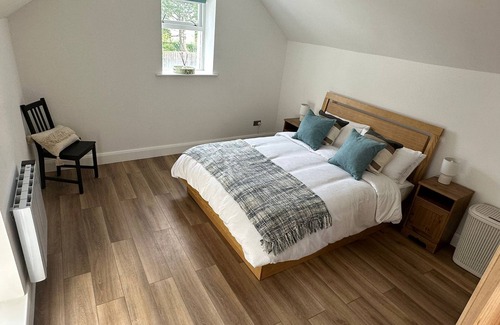 Cushendall House | Central Accommodation in a Converted Stables with a Hot Tub & Enclosed Yard