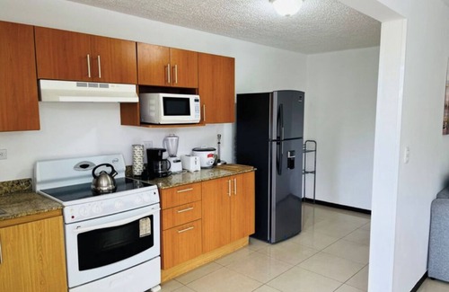 Barrio Santa Lucia Apartment | Charming 3-bedroom apartment with AC and WiFi in delightful Jacó.