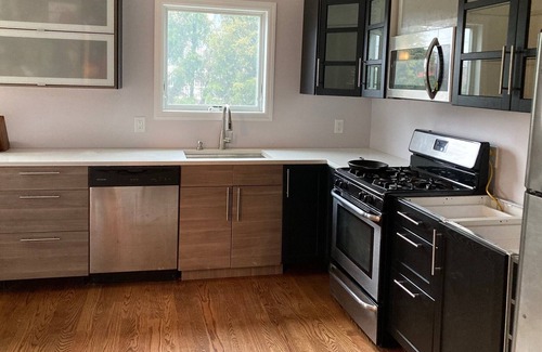 Long Beach House | Charming canal-front apartment with dock & kayak, walk to restaurants and beach