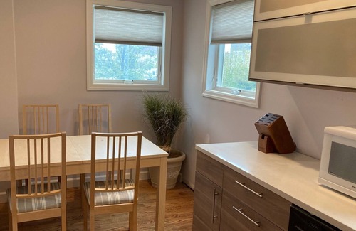 Long Beach House | Charming canal-front apartment with dock & kayak, walk to restaurants and beach