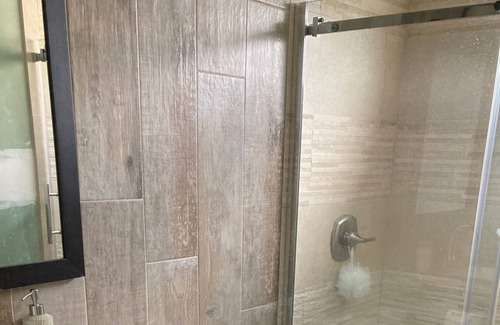 Long Beach House | Charming canal-front apartment with dock & kayak, walk to restaurants and beach