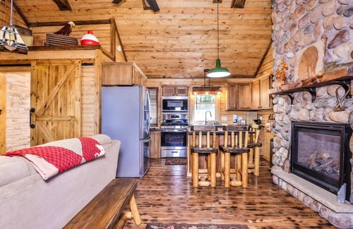 Eagle River Cabin | Charming, lakefront home with a gas fireplace, docks, firepit, & full kitchen