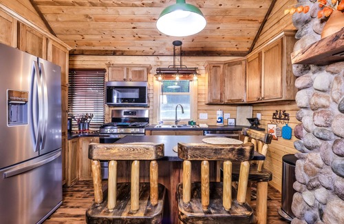 Eagle River Cabin | Charming, lakefront home with a gas fireplace, docks, firepit, & full kitchen