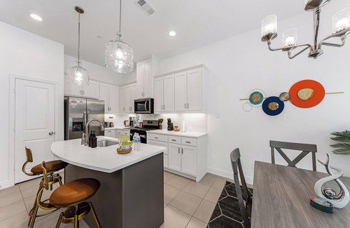 Lewisville House | Chic Townhome: Arcade Games, EV Charging, Putting Green, & Luxury Decor!