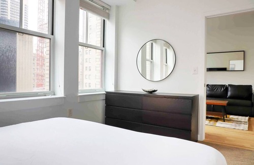 Midtown Village Apartment | City VIEW with King Bed, GYM, Rooftop, and Lounges