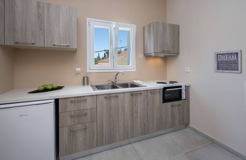 Kassiopi Apartment | Close to the beach, spacious one-bedroom apartment with sea views.