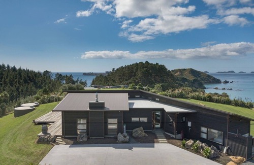 Kaeo House | Coastal Gem. Great sea views, decks for outdoor living and safe swimming beach.