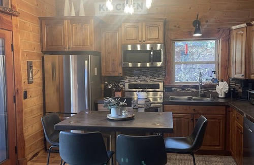 Munds Park Ski Chalet | Coco's Creekside Cabin with Hot Tub, Firepit, and AC/Heat in Munds Park!