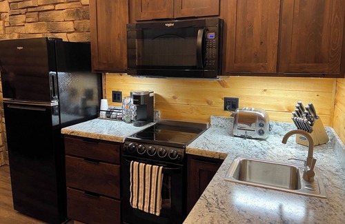 Sabetha Apartment | Comfort Loft Cabin with Kitchen! Tiny Home Inspired Style right on Main Street!