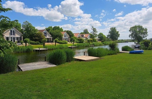 Makkum House | Comfortable 6-person Link Deluxe bungalow with yard, patio, and water view at Beach Resort Makkum on the IJsselmeer.