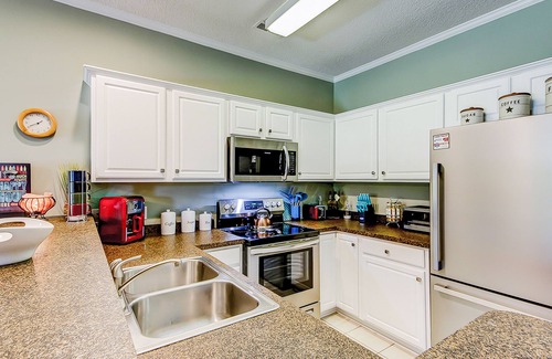 Little River House | Comfortable townhome with loft, shared pool, WiFi, AC, & W/D - near beach & golf