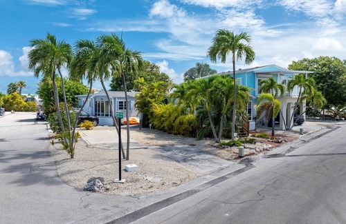Cudjoe Key RV Rental | Corner RV Lot with Lagoon Views, Palm Trees, and Steps to Pool & Amenities